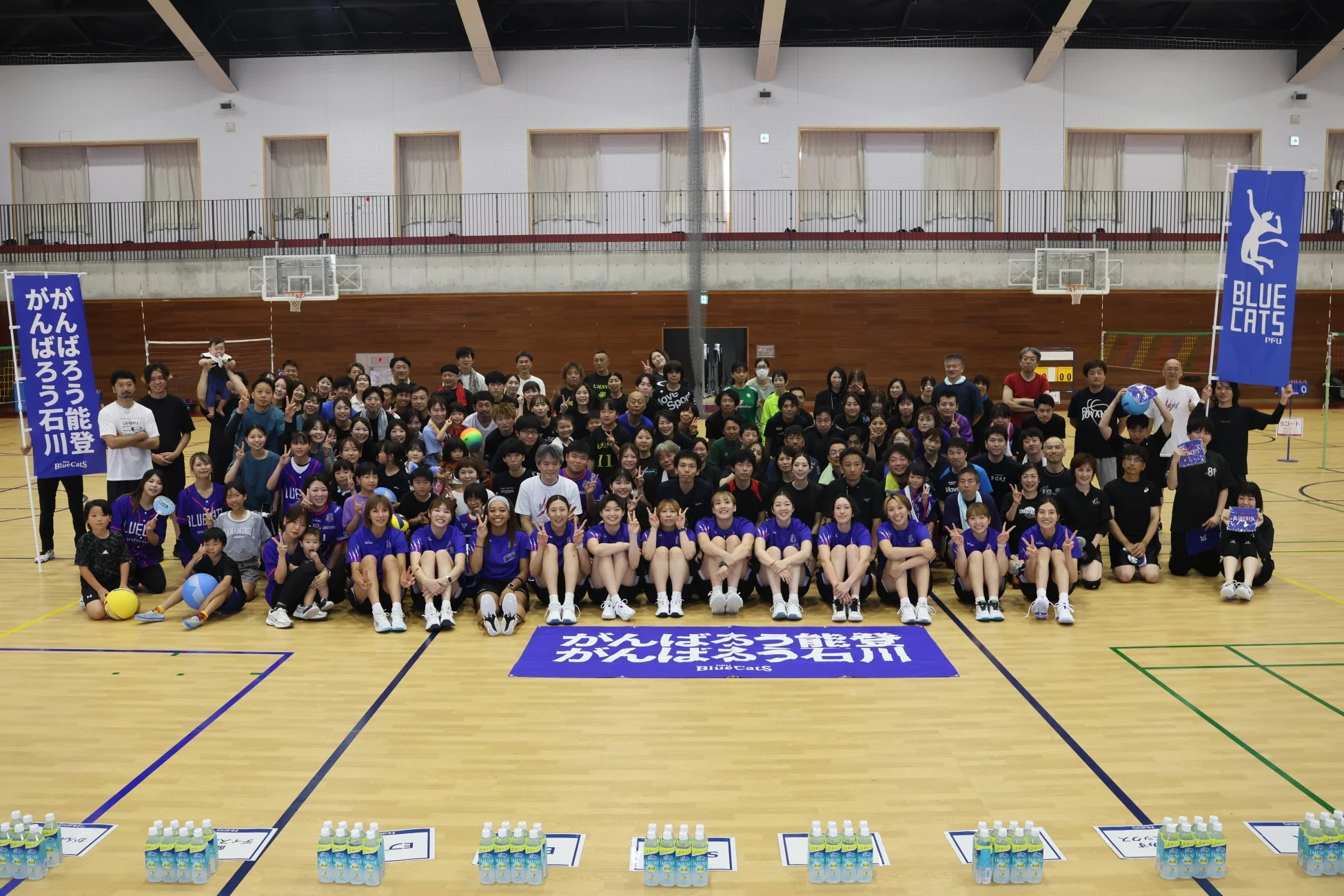 がんばろう石川 がんばろう能登を掲げた集合写真